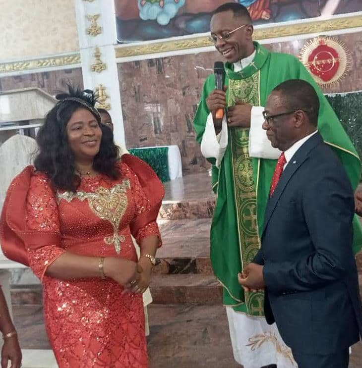 Prof. (Mrs) Rita Cyril Ndifon (Left), facing her husband, Prof. Cyril Ndifon (Right); with Rev. Fr. Richmond Diala (Behind), during a Thanksgiving service in honour of Mrs Ndifon at the Holy Trinity Parish, Calabar, Cross River State. 21 Jan. 2024.