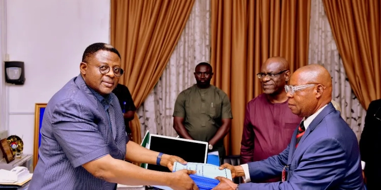 Governor Bassey Otu of Cross River State received a fact-finding-committee report on the activities of ENG-HAUT Industries Limited, from the Secretary of the committee, Barr. David Amlye who represented the Chairman of the committee, Major Gen. Okoi Ubi Obono Rtd