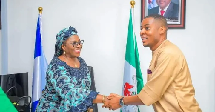 R-L: Rev Mrs Eyoanwan Bassey Otu in a handshake Rt. Hon. Peter Odey