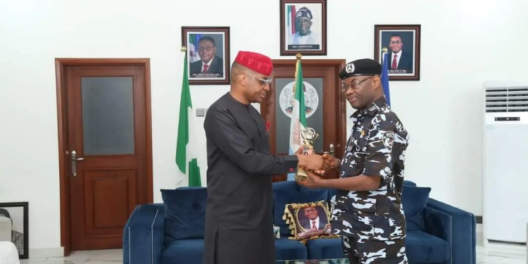 L-R: Rt. Hon. Peter Odey in a handshake with DIG Sokari Pedro