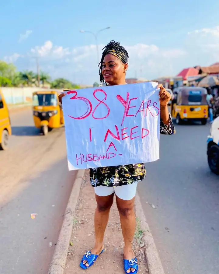 38-year-old lady in need of husband storms the streets with placard