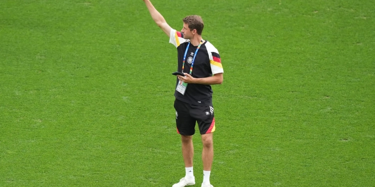Germany's Thomas Mueller inspects the pitch prior to the start of the UEFA Euro 2024 round of 16 soccer match between Germany and Denmark at Dortmund stadium. Credit: Marcus Brandt/dpa