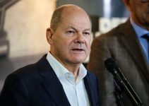 Scholz, at struggling Ford plant, urges EU electric vehicle subsidies