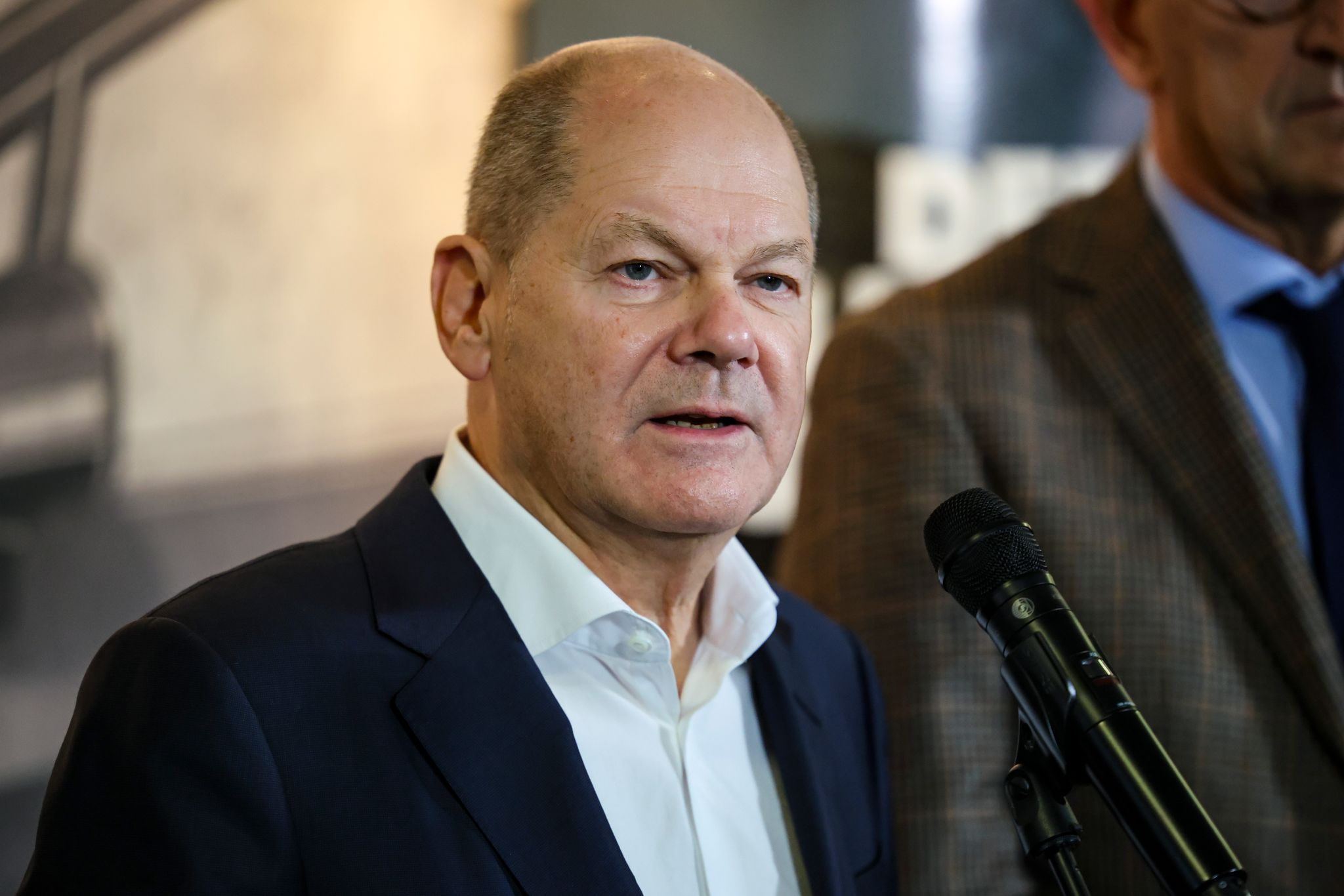 Scholz, at struggling Ford plant, urges EU electric vehicle subsidies