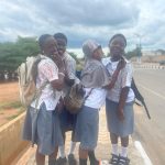 Secondary school students sign out on uniforms after completing WAEC