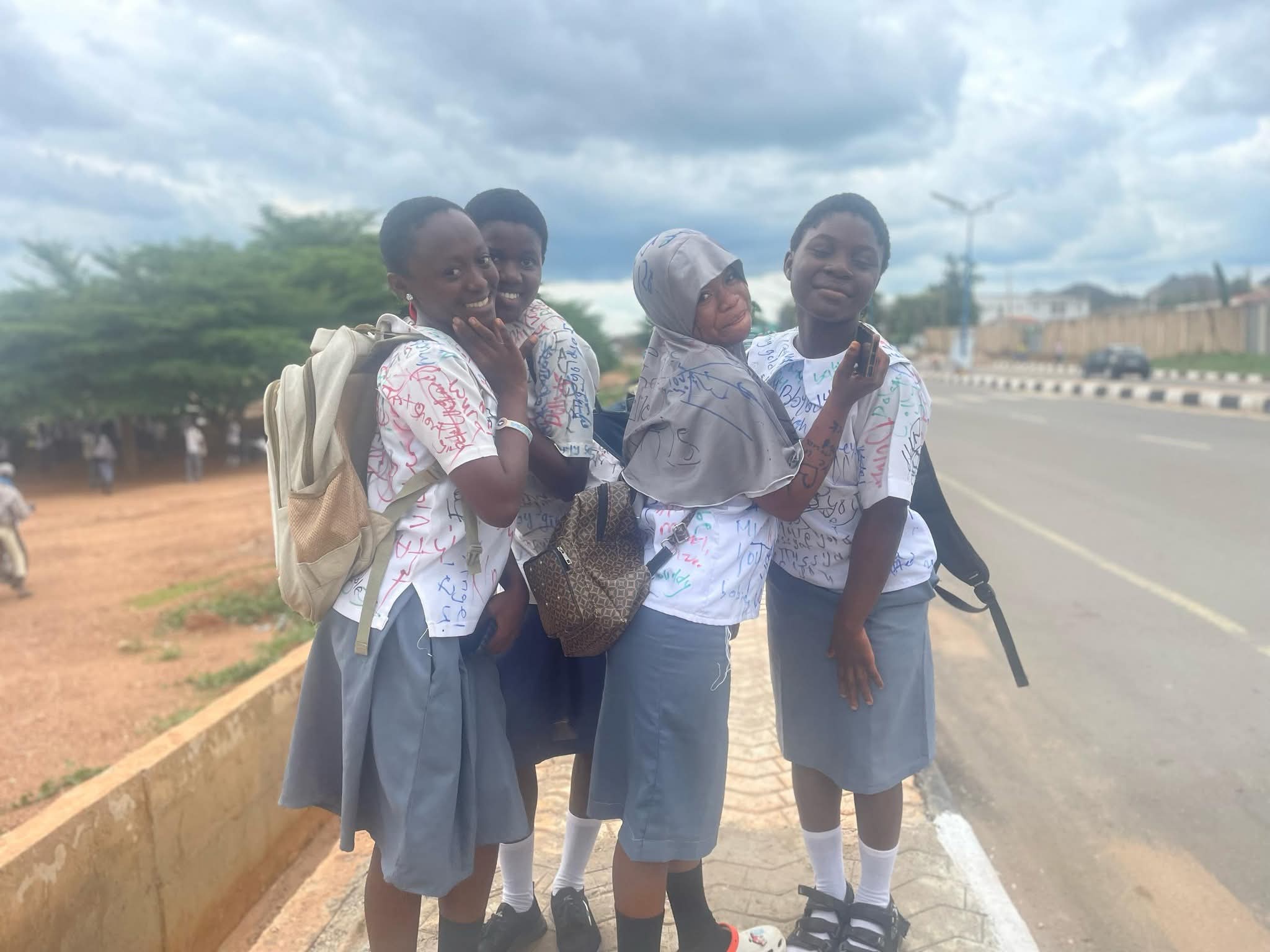 Secondary school students sign out on uniforms after completing WAEC