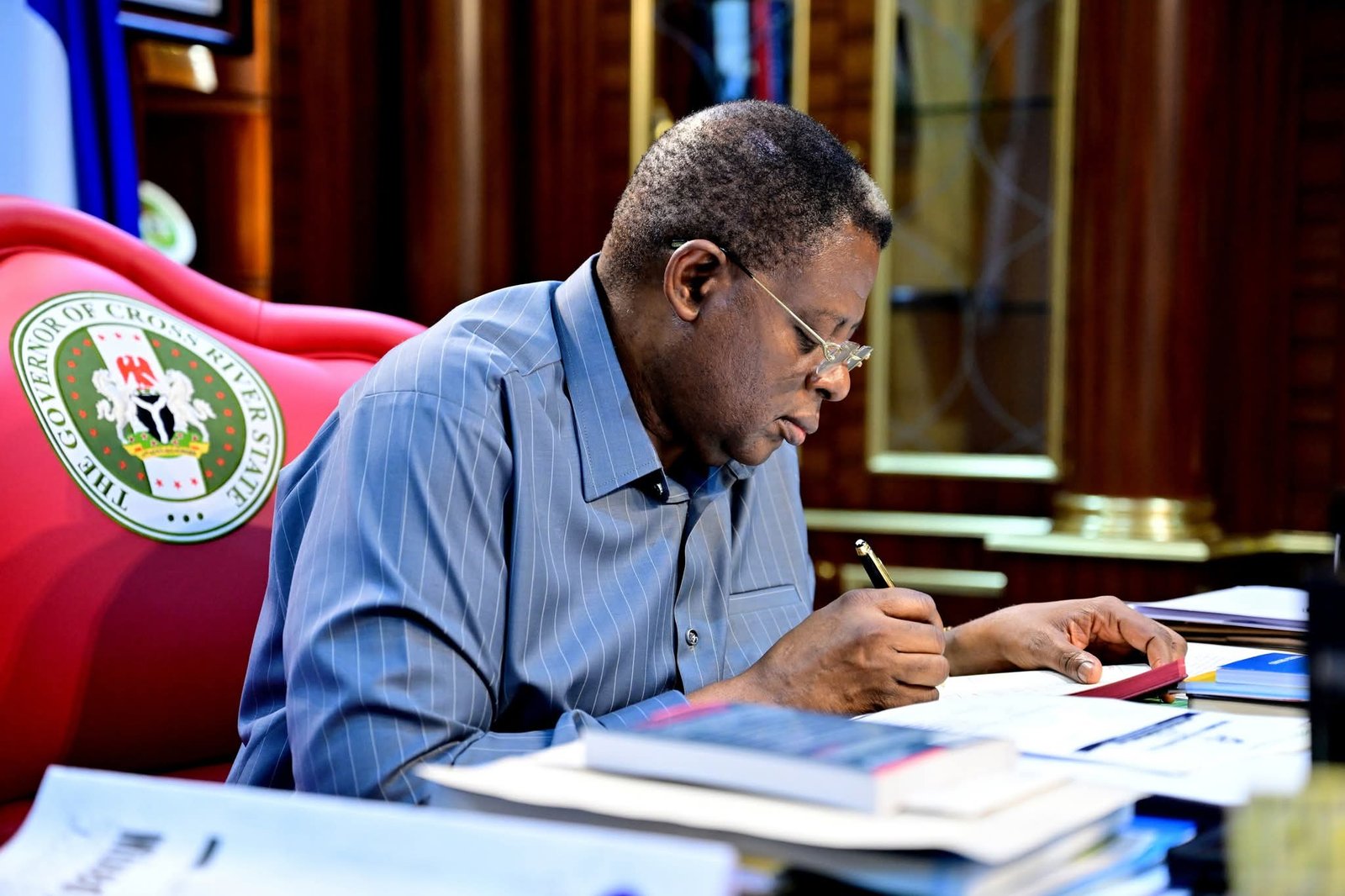 bassey otu signing Gov Otu clears land rent arrears for Etung Cocoa Estate landlord communities