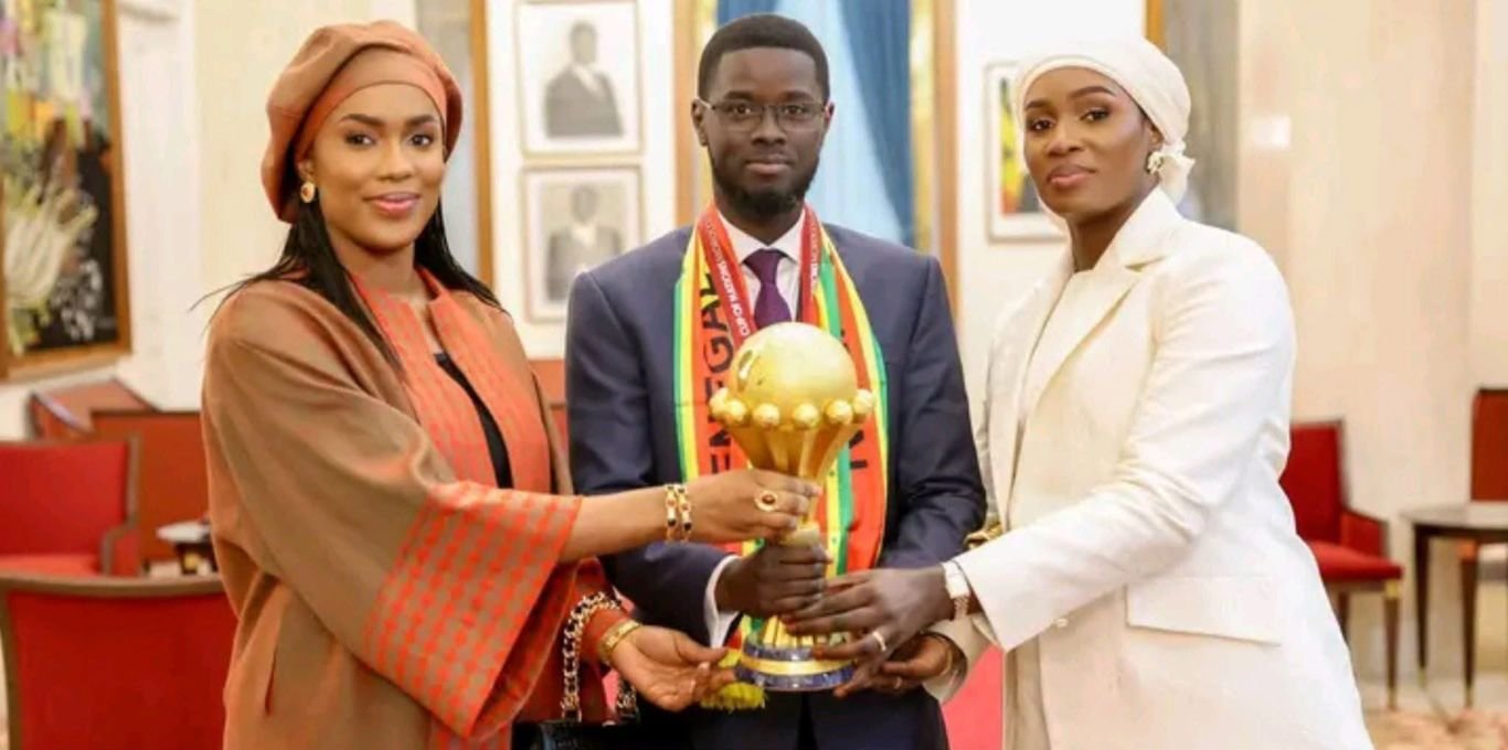 Bassirou Diomaye Diakhar Faye wives and AFCON Trophy Reactions as Senegal President Faye poses with 2 wives and AFCON Trophy after Teranga Lions' victory