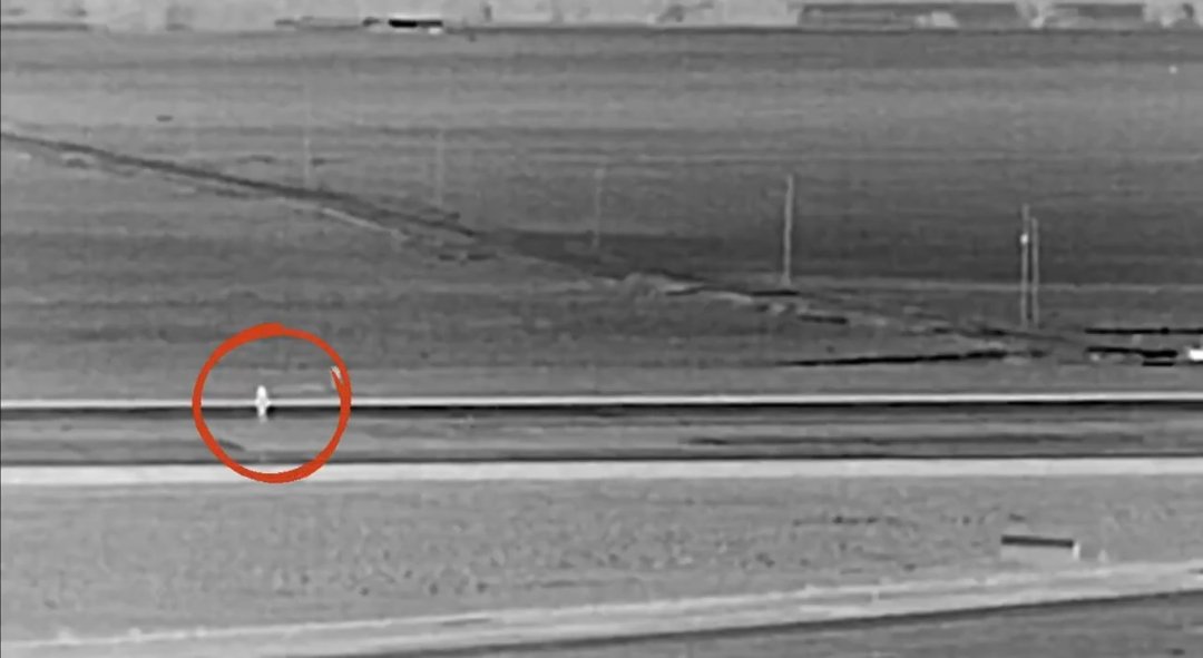 Screenshot 20260512 010843 VIDEO: Moment Individual Walks on Denver Airport Runway and Stands in front of Frontier Airlines jet